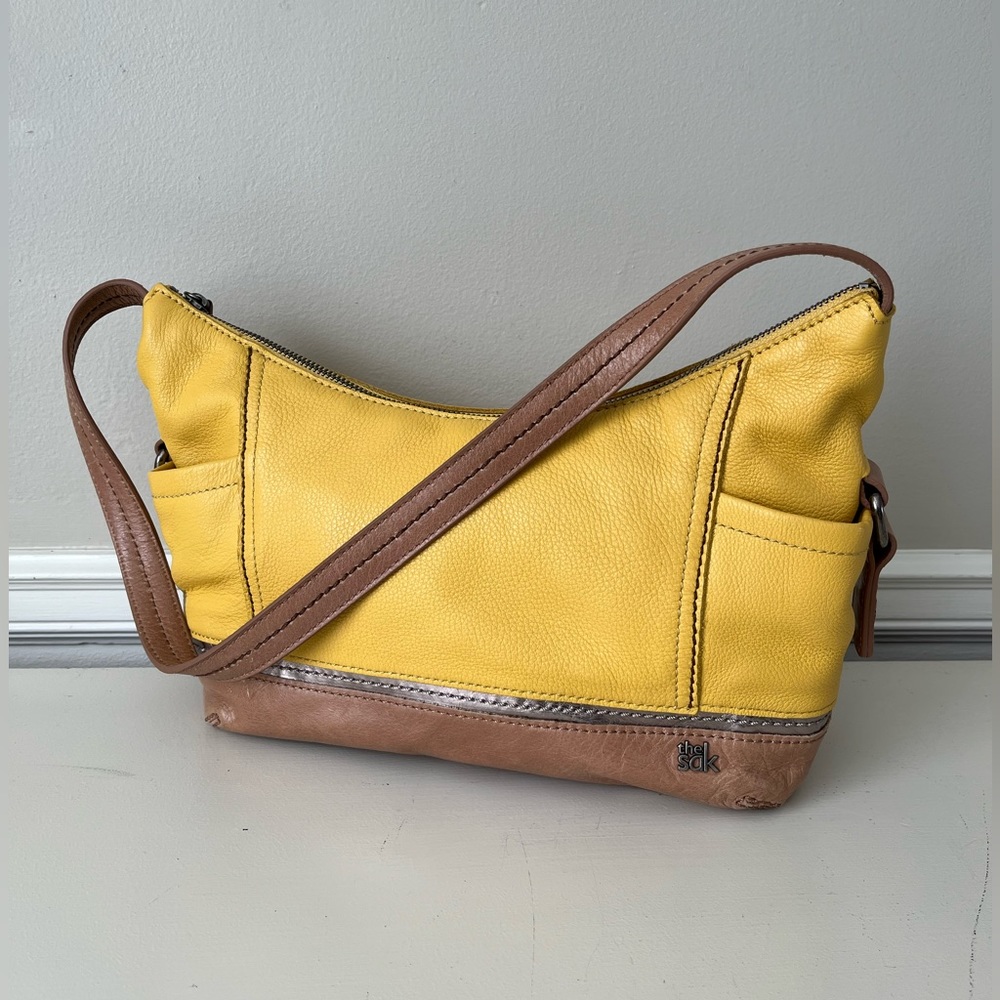 The Sak Kendra yellow leather purse